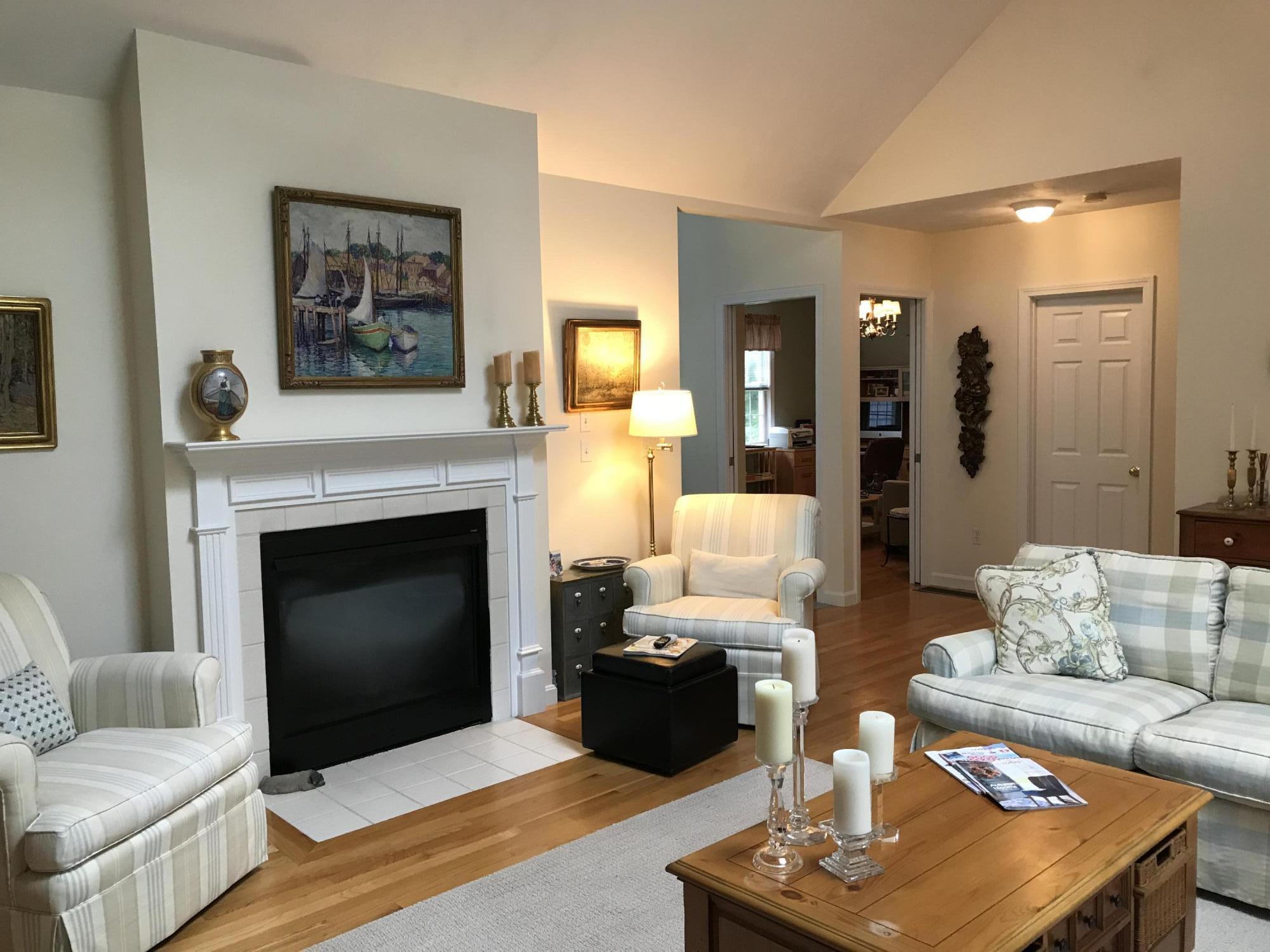40 Amos Landing Road Mashpee, MA 02649 - Photo 4 of 28 a living room with furniture and a fireplace