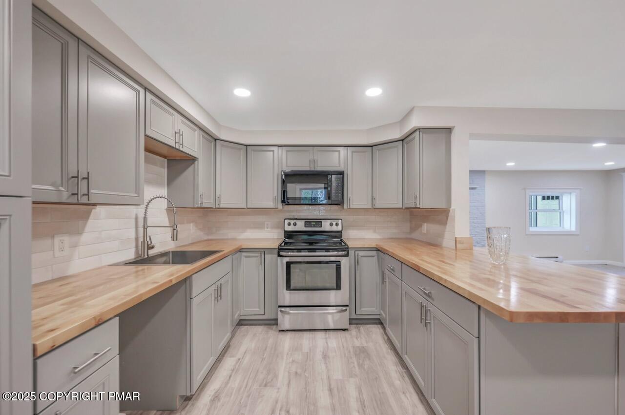 2128 Faratol Road East Stroudsburg, PA 18302 - Photo 12 of 85 a kitchen with a sink stove and refrigerator