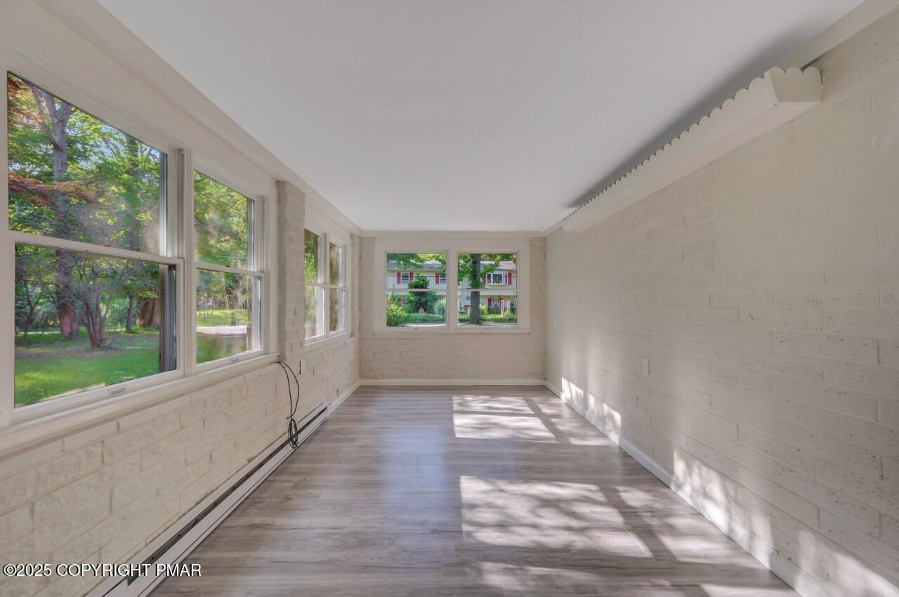 2128 Faratol Road East Stroudsburg, PA 18302 - Photo 29 of 85 a view of an empty room with wooden floor and a window