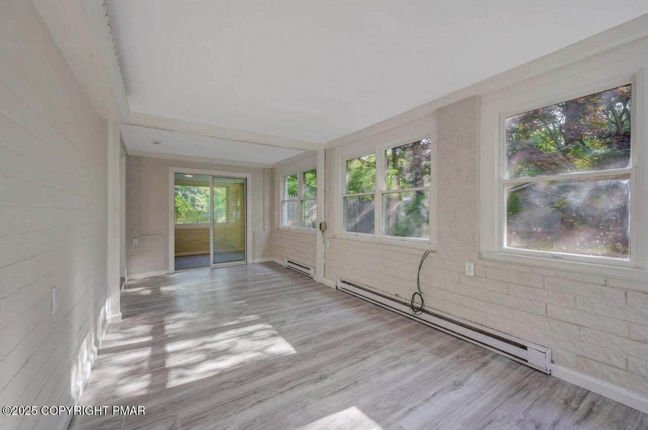 2128 Faratol Road East Stroudsburg, PA 18302 - Photo 30 of 85 a view of an empty room with wooden floor and a window