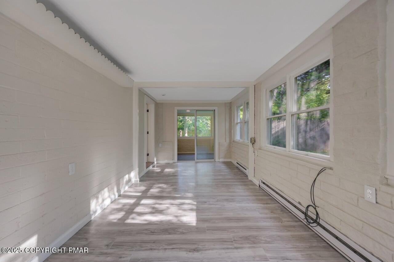 2128 Faratol Road East Stroudsburg, PA 18302 - Photo 31 of 85 a view of an empty room with wooden floor and a window