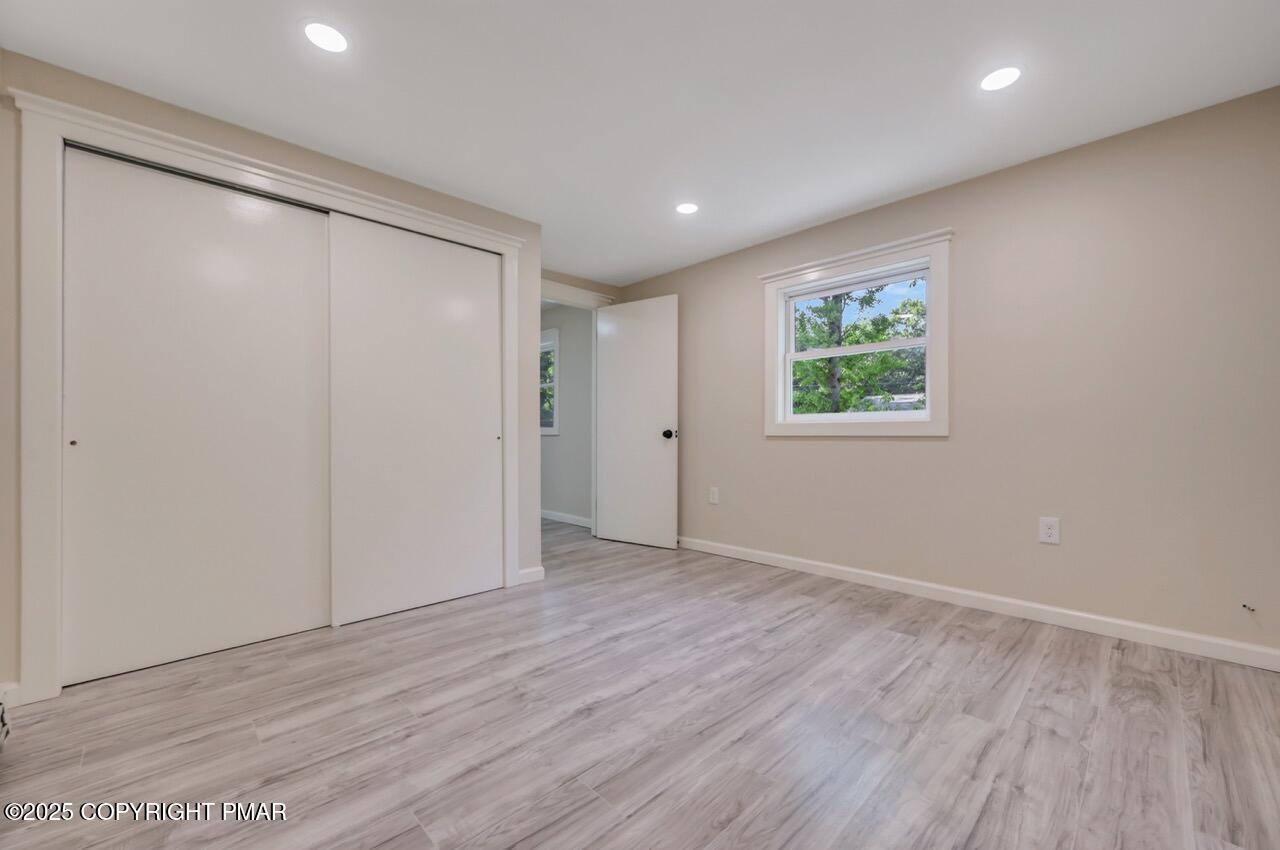 2128 Faratol Road East Stroudsburg, PA 18302 - Photo 34 of 85 a view of an empty room with wooden floor and a window