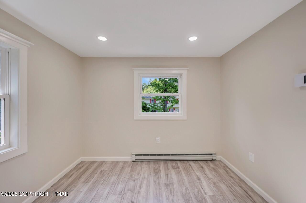2128 Faratol Road East Stroudsburg, PA 18302 - Photo 38 of 85 a view of an empty room with wooden floor and a window