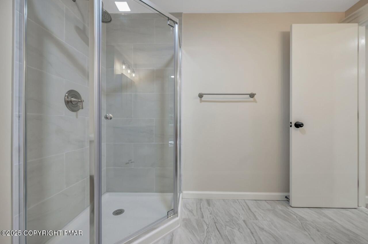 2128 Faratol Road East Stroudsburg, PA 18302 - Photo 48 of 85 a bathroom with a glass shower door