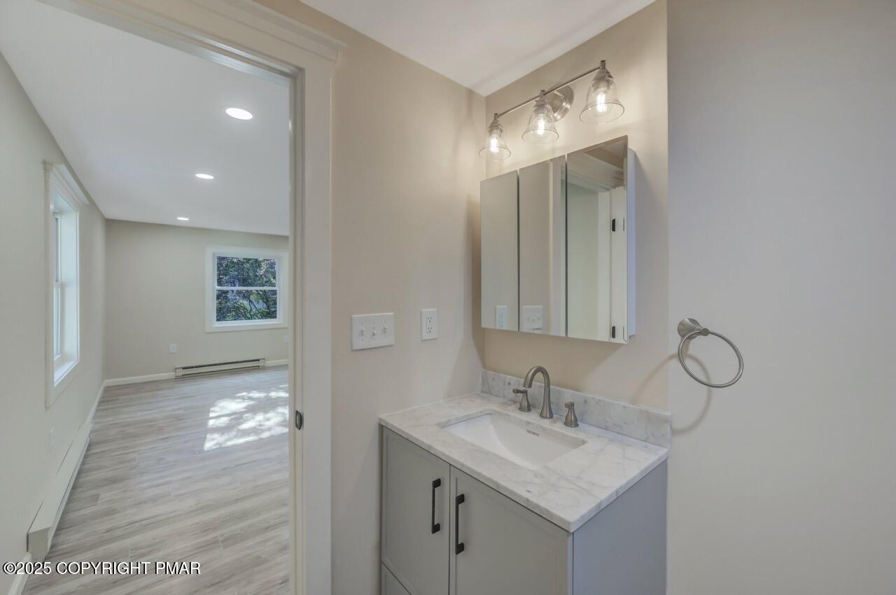 2128 Faratol Road East Stroudsburg, PA 18302 - Photo 49 of 85 a bathroom with a sink vanity and mirror