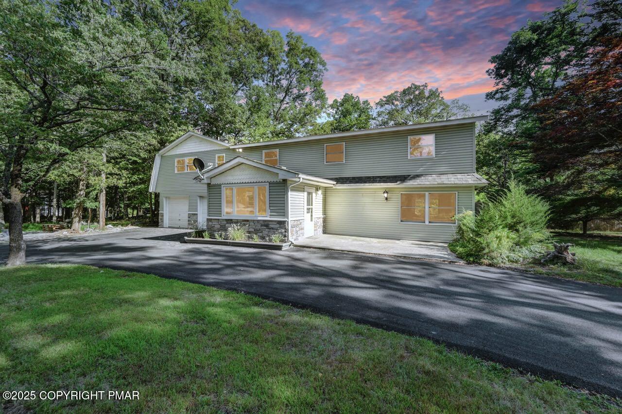 2128 Faratol Road East Stroudsburg, PA 18302 - Photo 5 of 85 a front view of a house with a yard