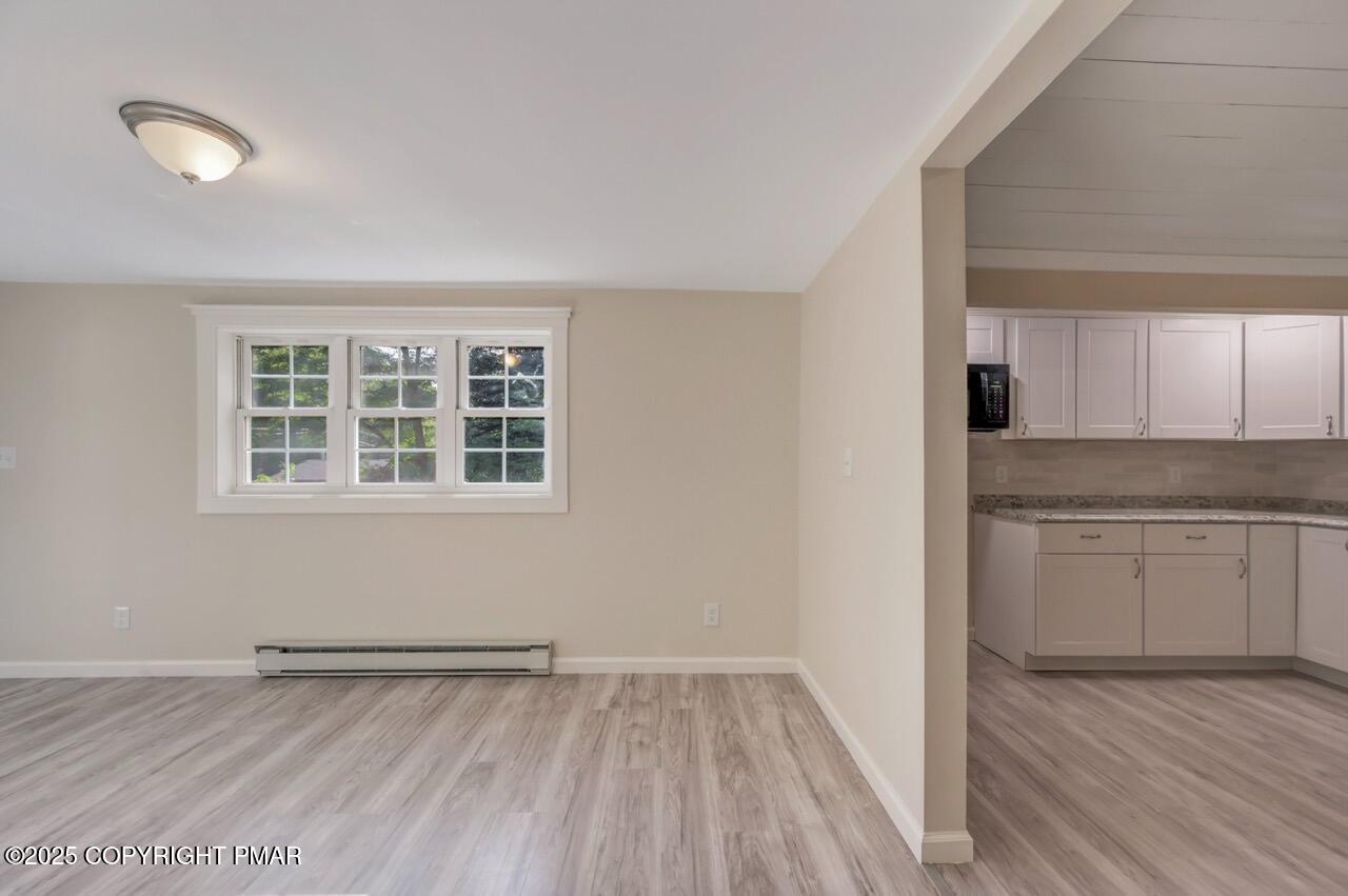 2128 Faratol Road East Stroudsburg, PA 18302 - Photo 57 of 85 a view of a kitchen with a sink and dishwasher with wooden floor