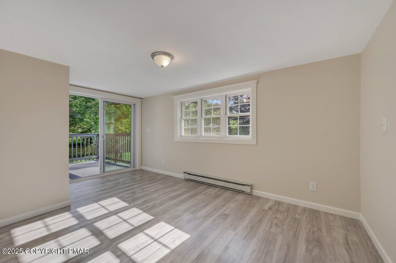 2128 Faratol Road East Stroudsburg, PA 18302 - Photo 58 of 85 a view of an empty room with wooden floor and a window
