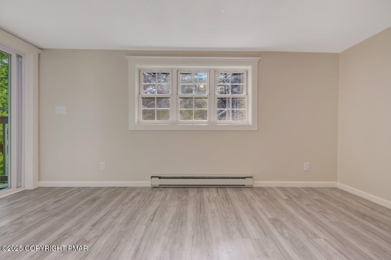 2128 Faratol Road East Stroudsburg, PA 18302 - Photo 59 of 85 wooden floor in an empty room with a window