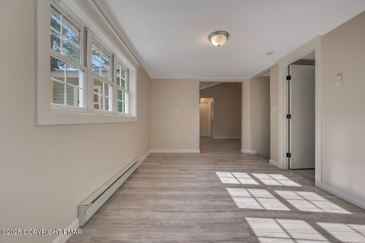 2128 Faratol Road East Stroudsburg, PA 18302 - Photo 60 of 85 a view of an empty room with window and stairs