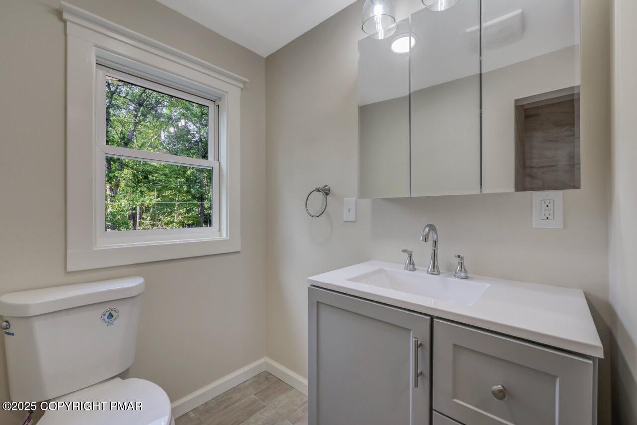 2128 Faratol Road East Stroudsburg, PA 18302 - Photo 73 of 85 a bathroom with a sink a toilet and a window