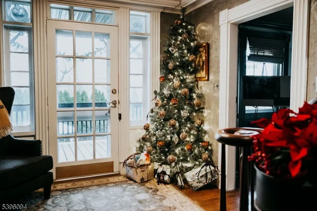 a bedroom with a bed and a dresser next to a window