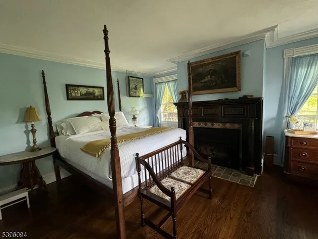a bedroom with bed and window