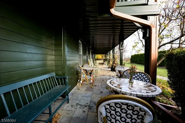 a view of a patio in the backyard