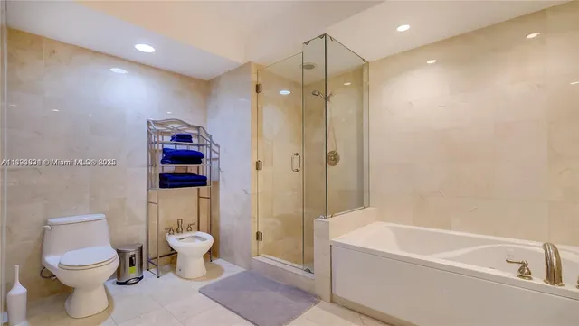 a bathroom with a shower sink vanity and mirror
