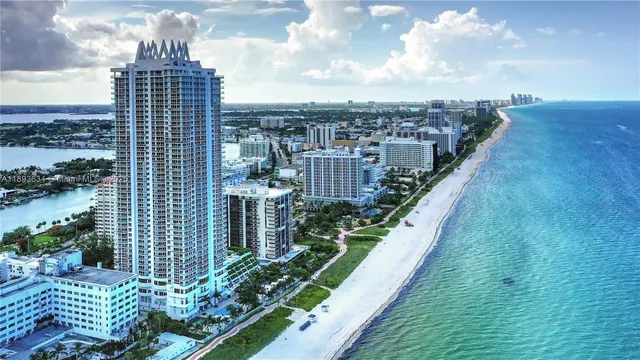 a lobby with furniture and floor to ceiling window