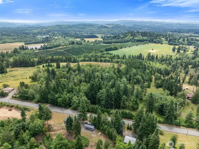 an aerial view of residential building with outdoor space and lake view