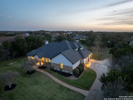 an aerial view of a house with mountain view