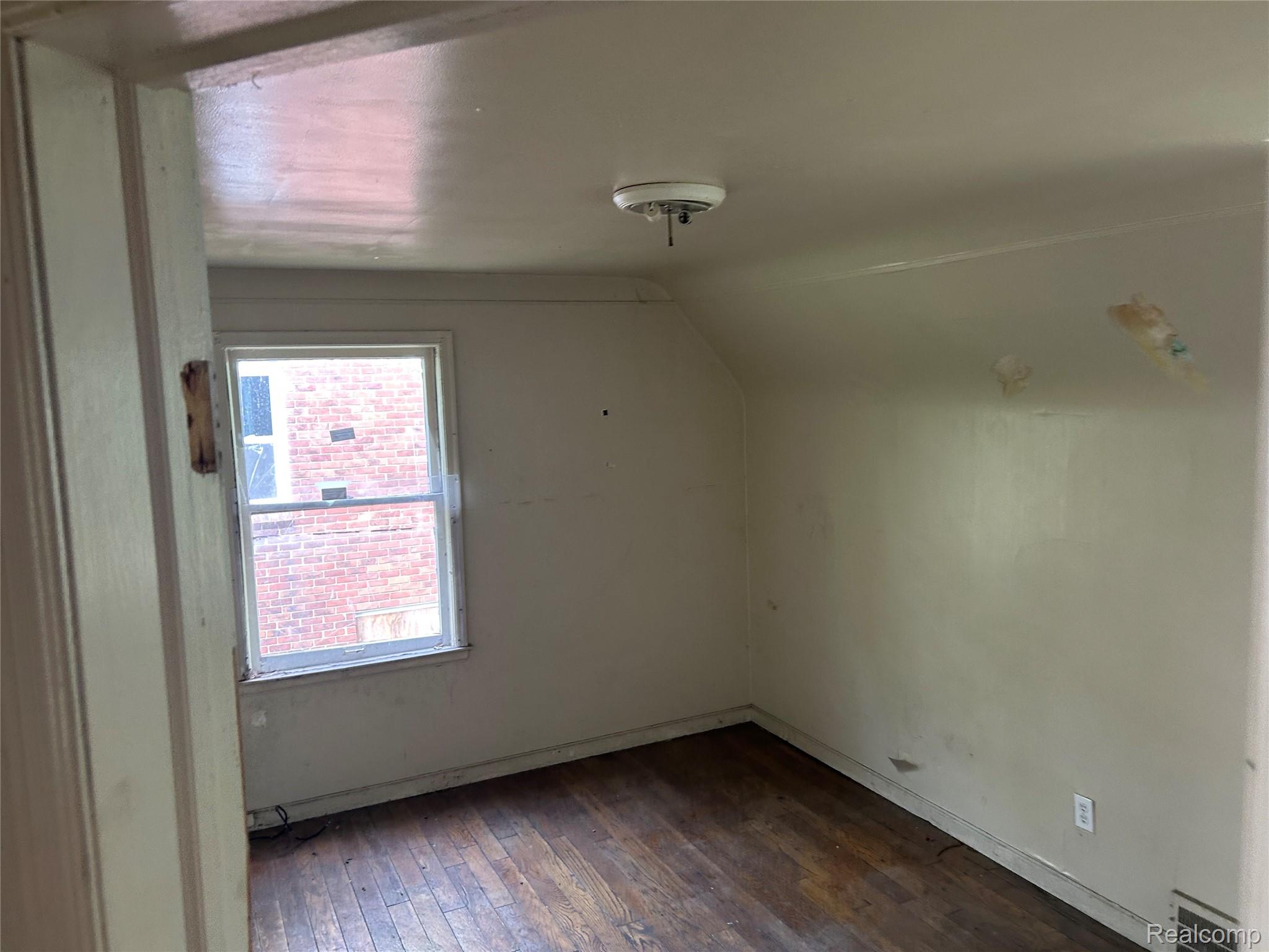 12641 Kelly Road Detroit, MI 48224 - Photo 21 of 40 Hardwood flooring featuring an overhead light fixture and a window