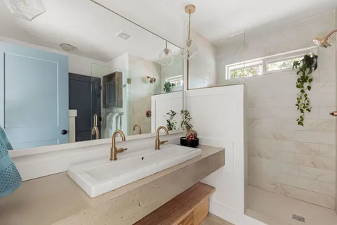 a bathroom with a sink and a mirror