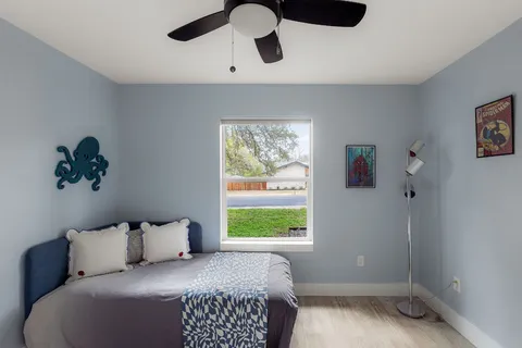 a bedroom with bed and window