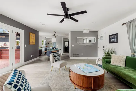 a living room with furniture and a rug
