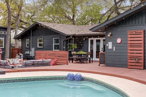 a view of a chairs and table in a patio