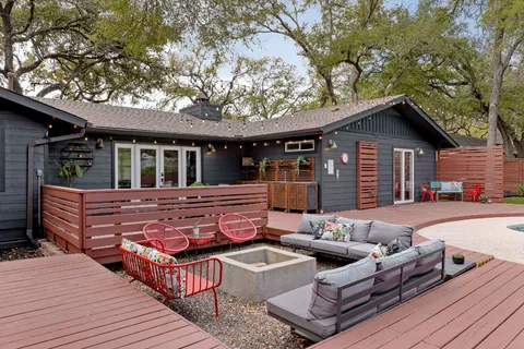 a bedroom with a large bed and a large window