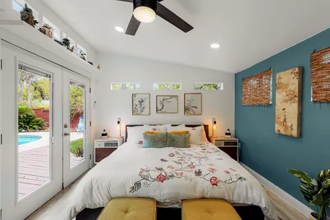 a utility room with a refrigerator and a stove