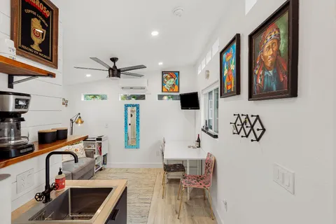 a living room with furniture and a lamp