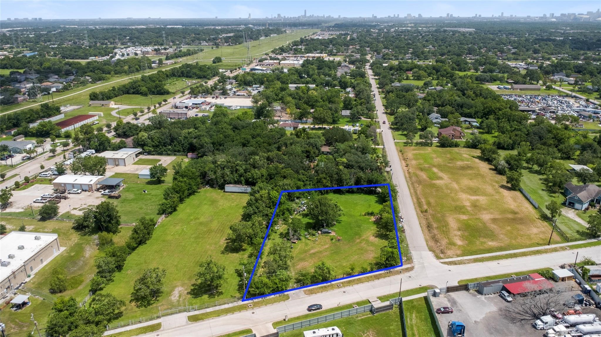 4410 Simsbrook Drive Houston, TX 77045 - Photo 1 of 3 an aerial view of residential houses with outdoor space and city view