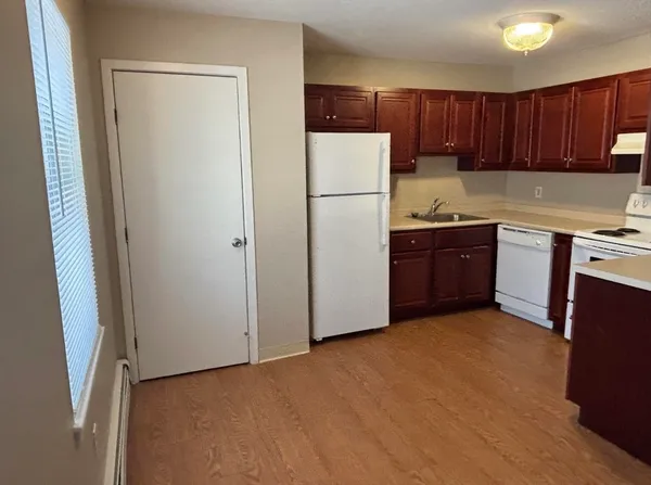 a kitchen with stainless steel appliances granite countertop a refrigerator stove a sink and dishwasher