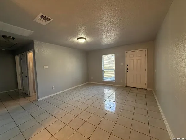 a view of an empty room and window