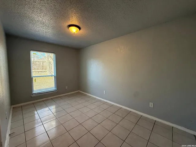 an empty room with windows and yard