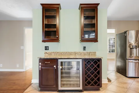 a kitchen with stainless steel appliances granite countertop a sink and cabinets