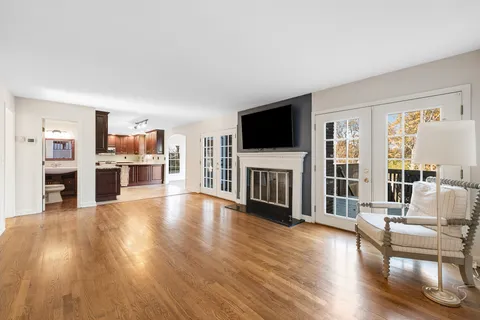 a living room with a flat screen tv and a fireplace