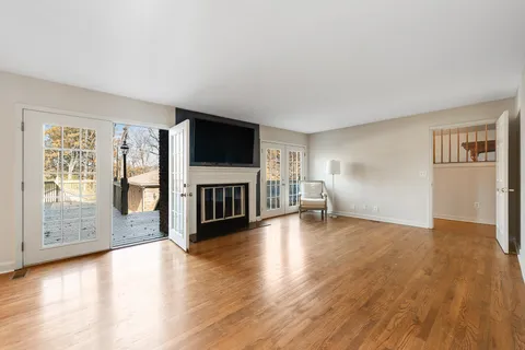 a bedroom with a bed and a view of kitchen