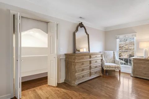 a spacious bathroom with a granite countertop sink a mirror and a shower
