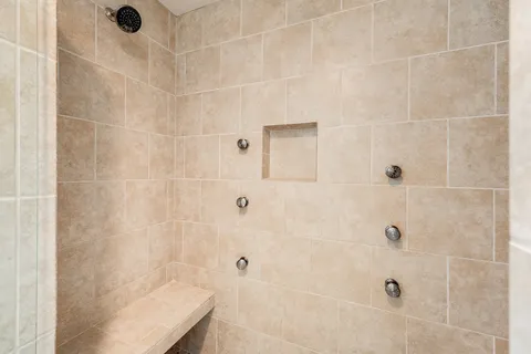 a en suite bathroom with a sink and a mirror