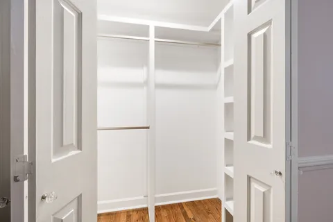 a room with pool table and windows