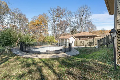a view of a house with wooden deck