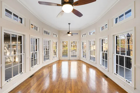 a kitchen with stainless steel appliances granite countertop wooden cabinets a stove a sink and a refrigerator