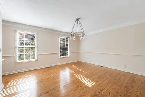 a kitchen with a sink counter top space appliances and cabinets