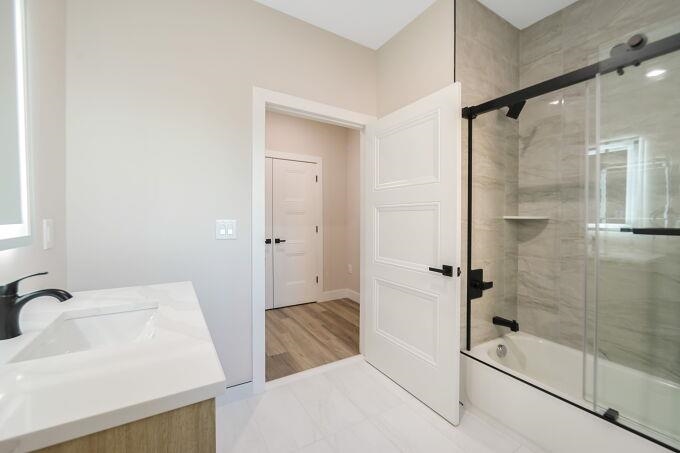304 61st Street, Unit 2C West New York, NJ 07093 - Photo 22 of 44 a bathroom with a bathtub and a shower
