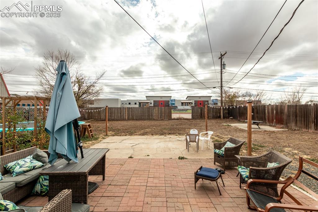 342 Mt View Lane Fountain, CO 80817 - Photo 16 of 17 a view of a patio with table and chairs potted plants with wooden floor