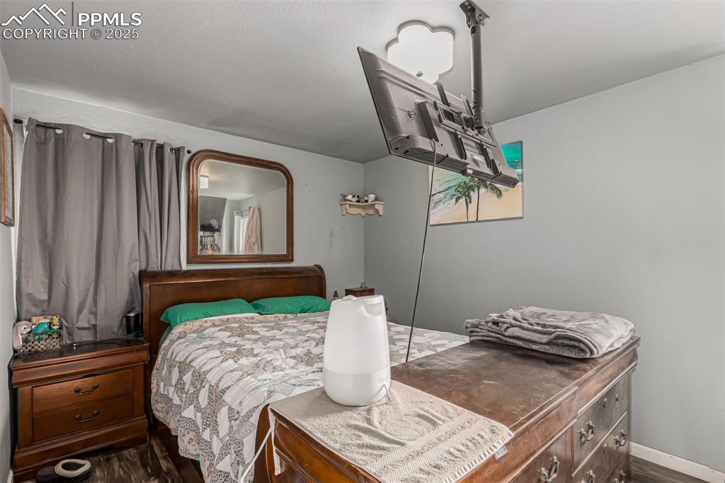 342 Mt View Lane Fountain, CO 80817 - Photo 4 of 17 a bedroom with a bed and dresser