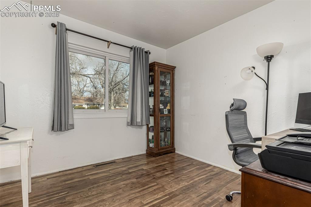 342 Mt View Lane Fountain, CO 80817 - Photo 8 of 17 a view of workspace with wooden floor windows
