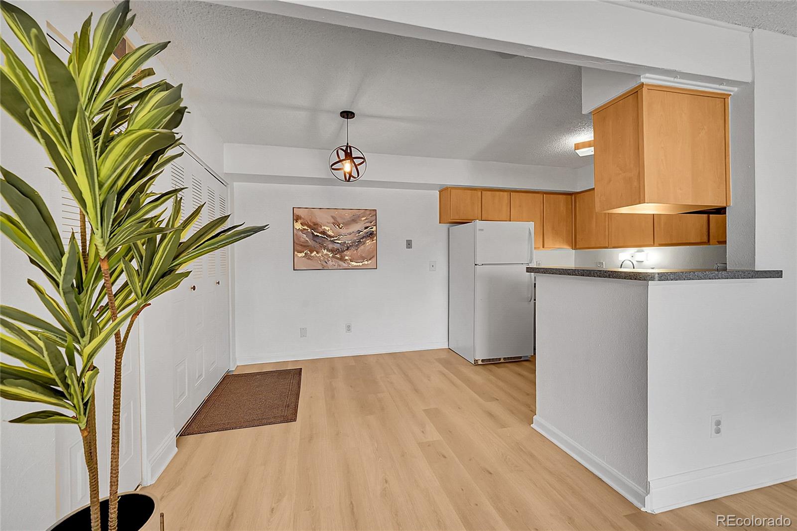 10251 West 44th Avenue, Unit 7108 Wheat Ridge, CO 80033 - Photo 6 of 21 a view of a kitchen with a sink and a window