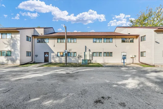 a kitchen with a sink a stove and cabinets
