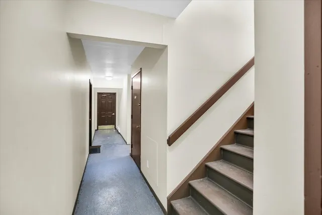 a view of an empty room with windows